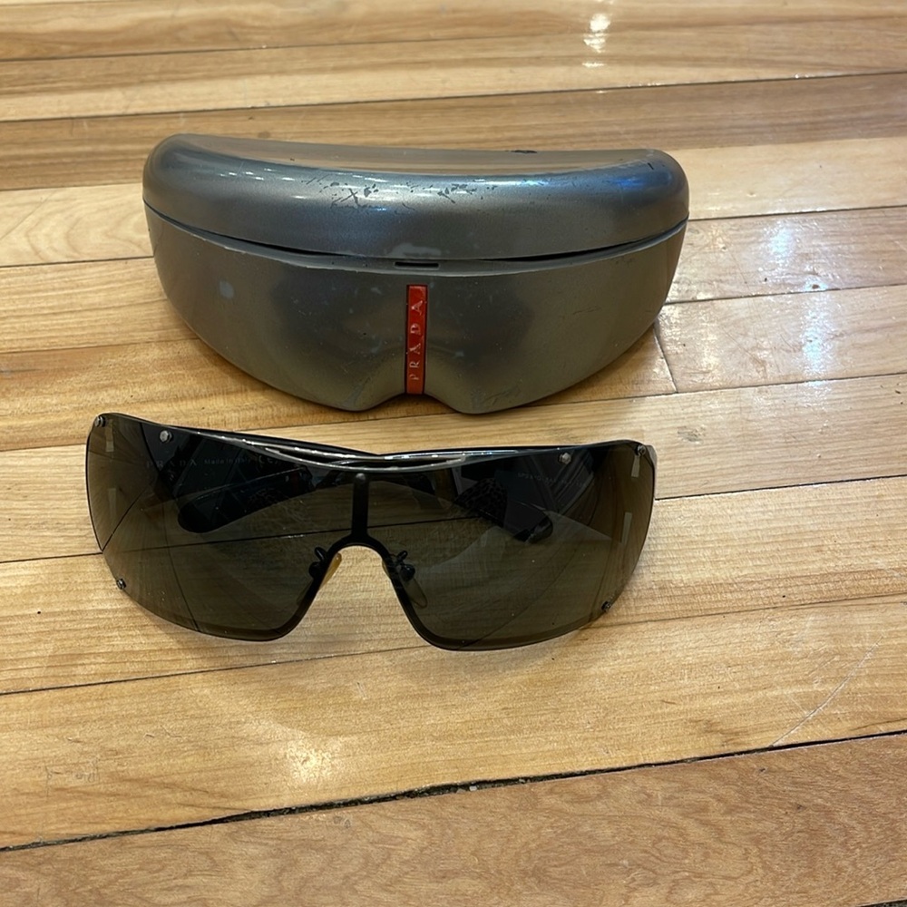 Prada UltraVox wrap around sunglasses.mint condition. Never worn. Unisex